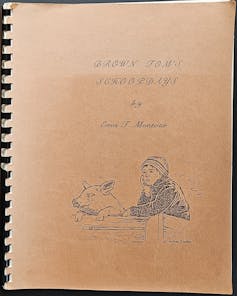 The cover of a spiral bound book, with illustration of a boy in a cap.