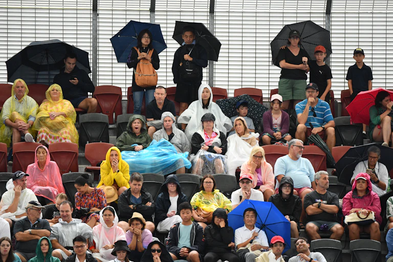 people in crowd during rain