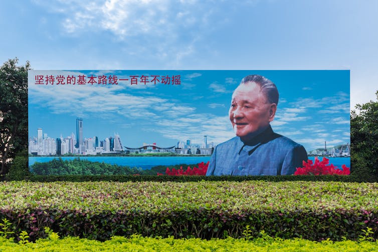 A billboard of Deng Xiaoping in a street in China.