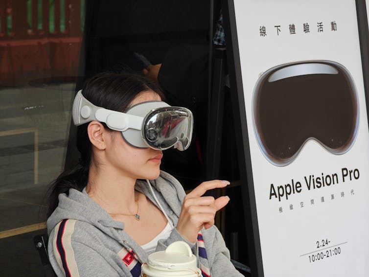 Woman trialling Apple Vision Pro glasses