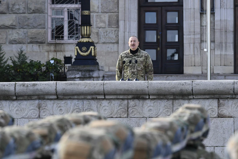 Ilham Aliyev presiding over a military parade.