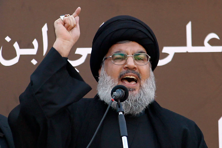 Hassan Nasrallah points as he makes a speech, September 2013.