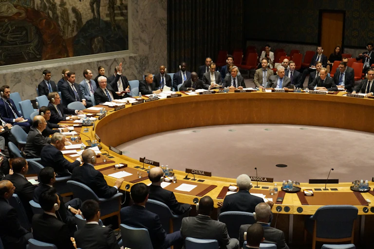 A group of people seated at a circular desk