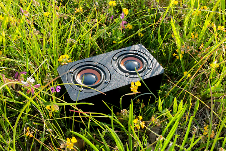 close-up of a portable audio device in the grass
