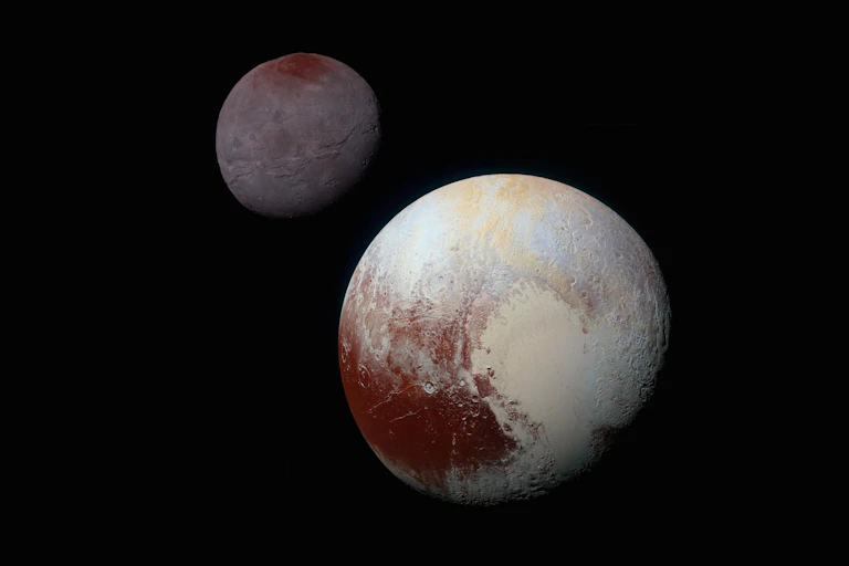 Two icy space bodies against black background.