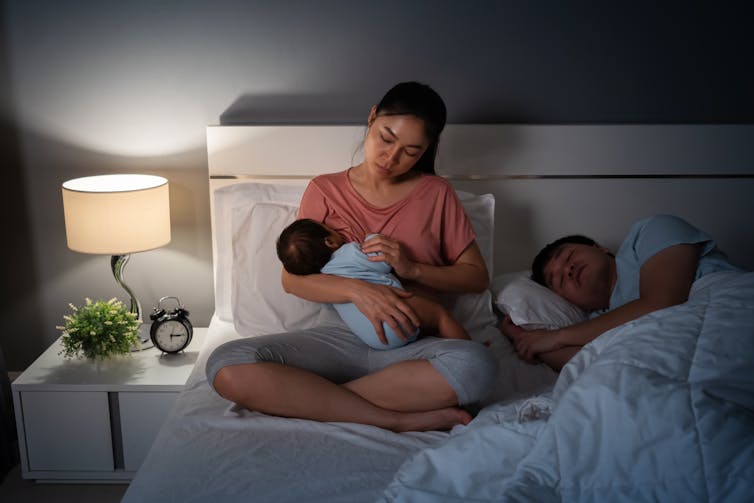 Woman breastfeeding at night