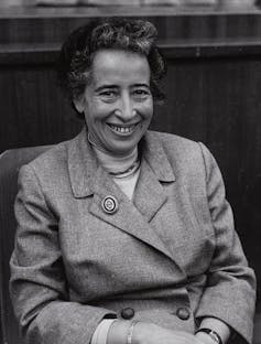Black and white photo of Hannah Arendt smiling