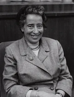 Black and white photo of Hannah Arendt smiling