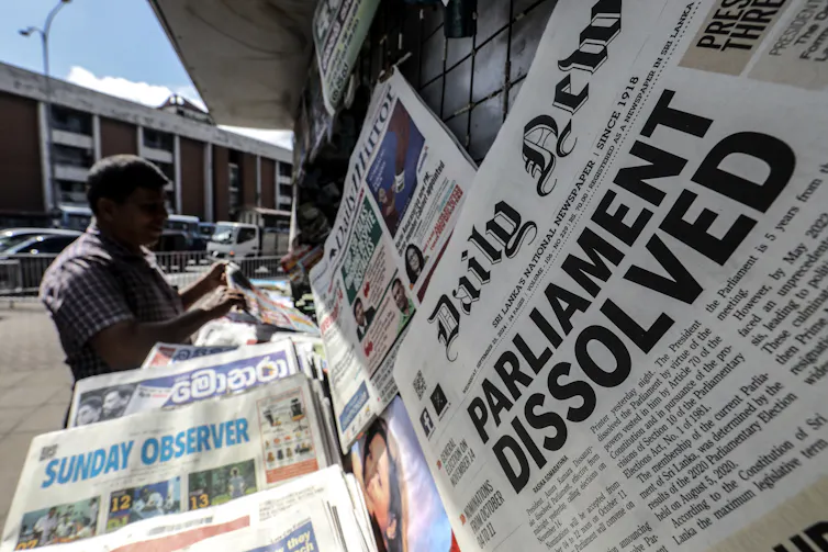 A newspaper with its front page featuring headline news about the dissolution of the parliament.