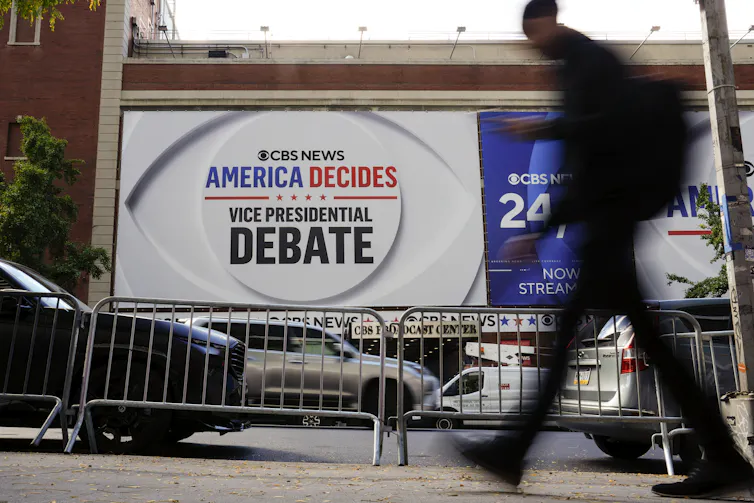 A billboard saying American Decides Vice-Presidential Debate