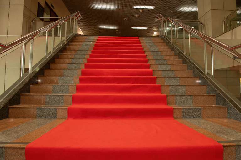 Red carpet on stairs at a theatre entrance