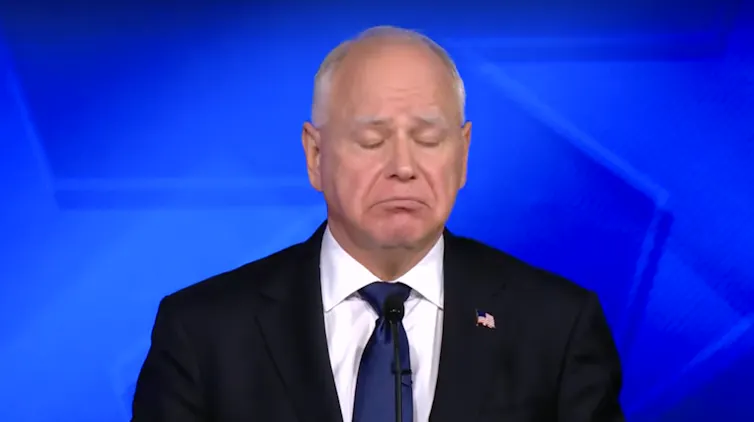 Bald man closes eyes and frowns.