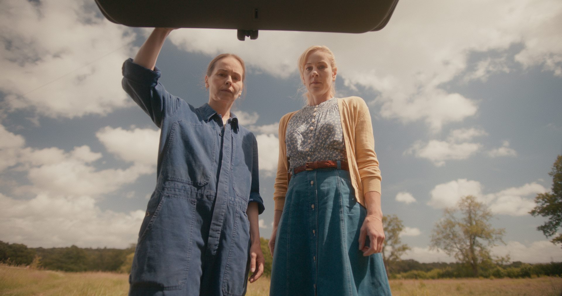 Tara Fitzgerald and Jeany Spark opening a car boot