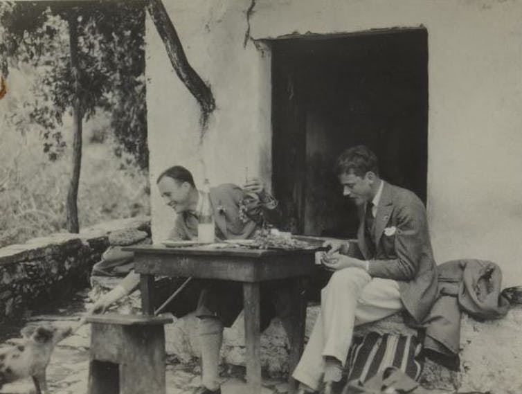 Black and white photo of two men in China