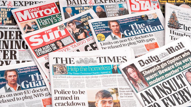 Pile of assorted UK newspapers, broadsheets and tabloids