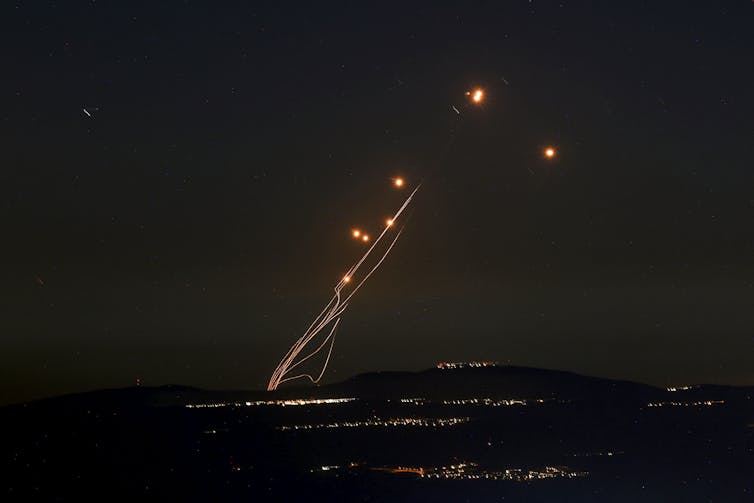 Bright lights are seen in the sky.