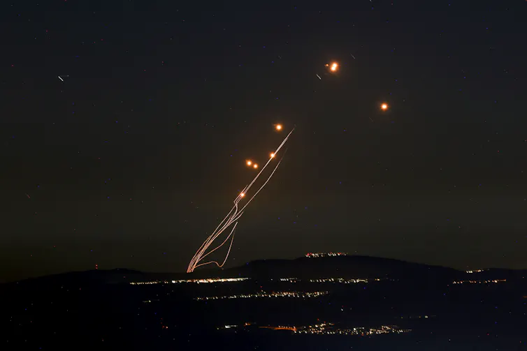 Bright lights are seen in the sky.