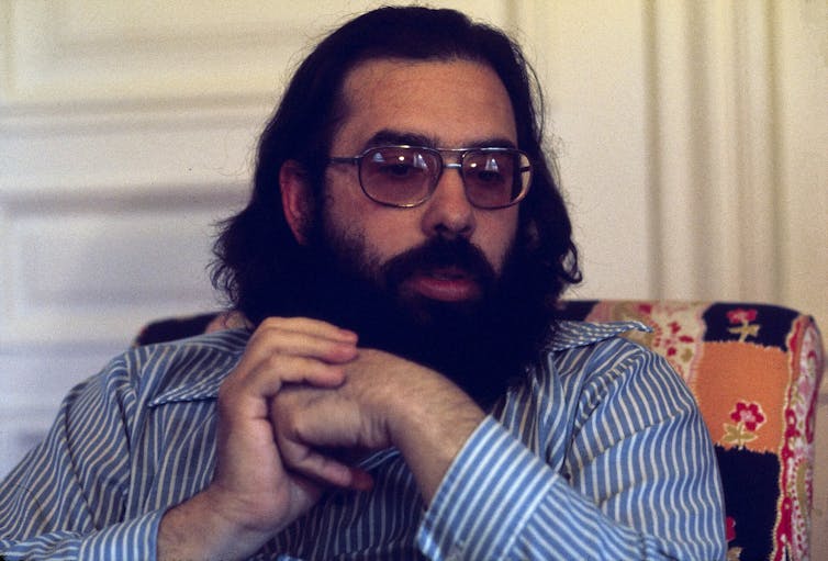 Coppola as a younger man, with long dark hair and a beard.