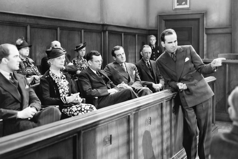 A lawyer talks to a jury in the 1960s