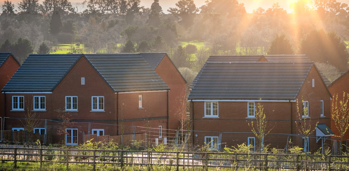 Tackling the UK’s housing crisis means addressing one key problem: affordability 'a group of houses in a field'