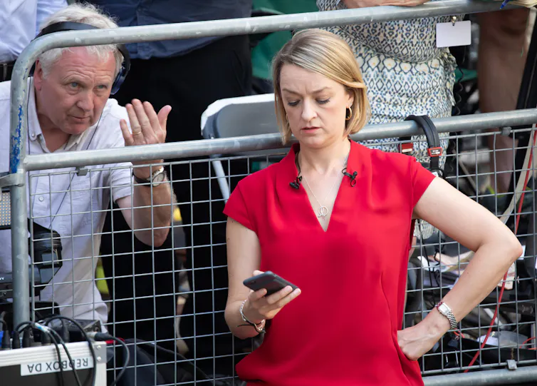 bbc political editor Laura Kuenssberg looking at her phone