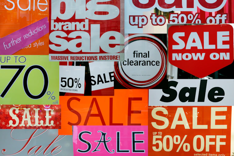 Collage of signs advertising sale prices