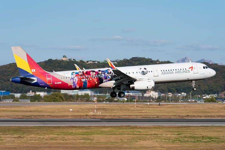 An aeroplane taking off from a runway.