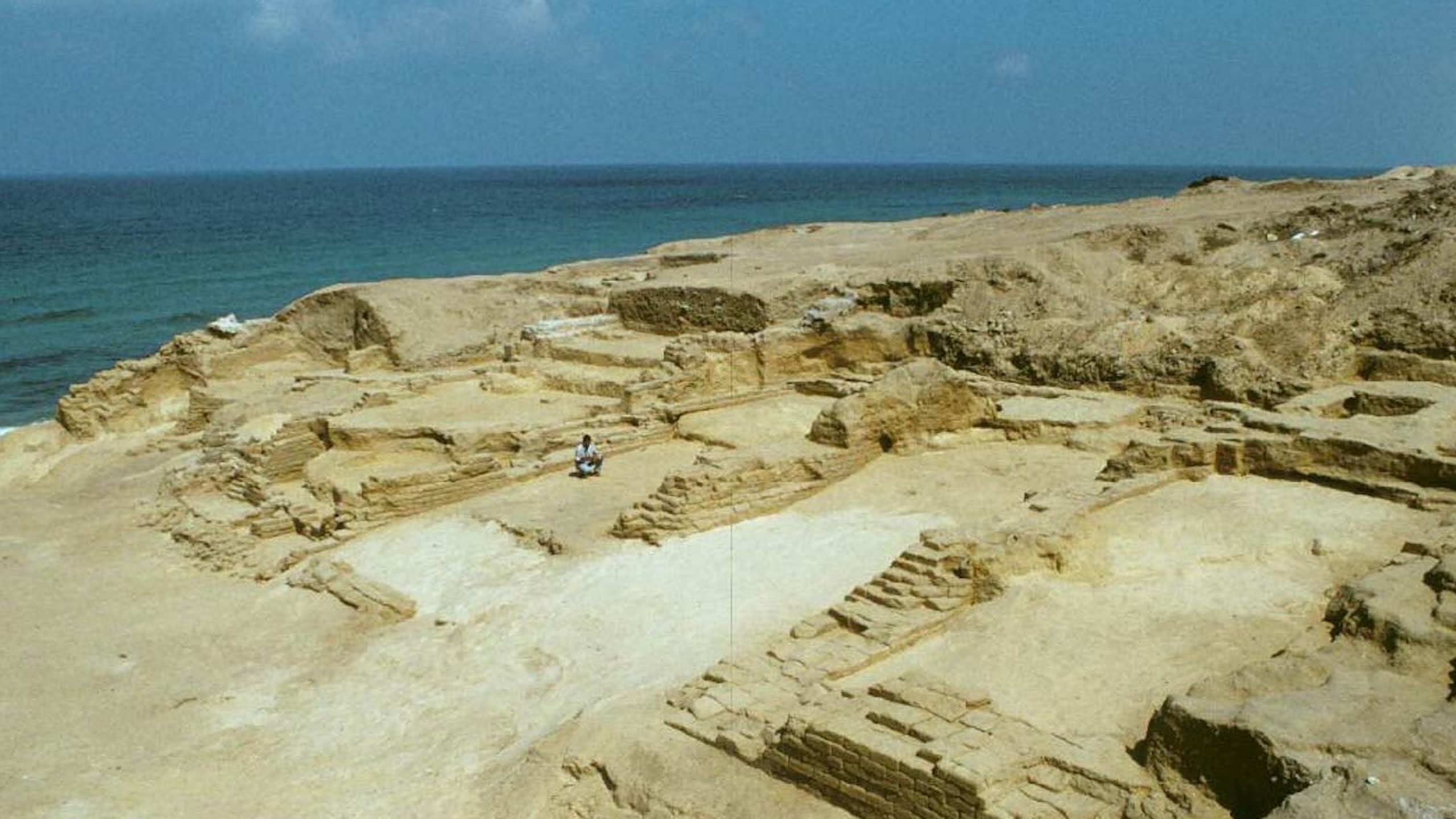 Photograph of an archaeological site next to the sea