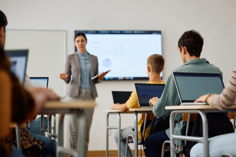 Students in classroom listening to teacher