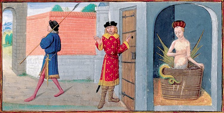 Two men behind a door while a half-woman, half-snake bathe in a tub inside