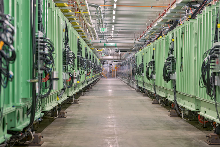 The inside of the Facility for Rare Isotope Beams, showing a hall of equipment.