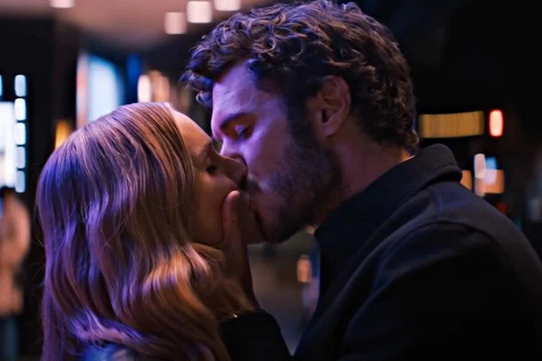 man and woman kissing