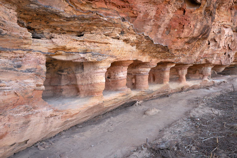 Hollows and pillars carved into a rockface