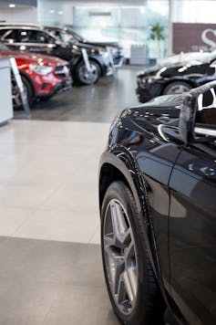new cars seen parked at a dealership
