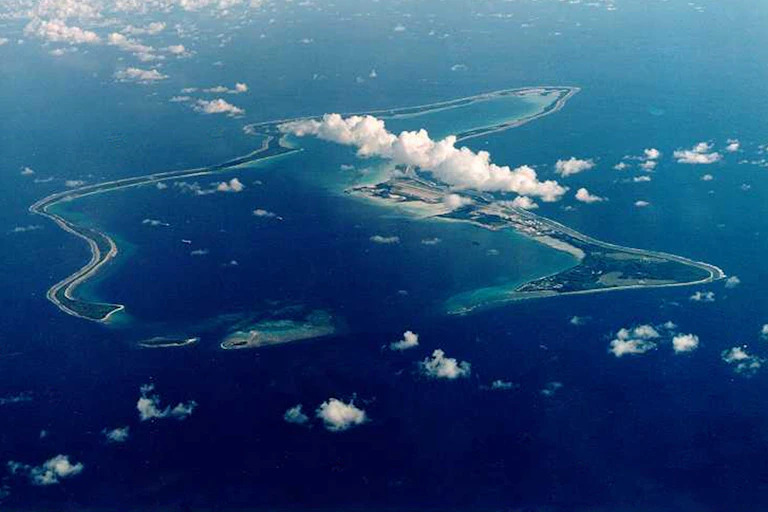 aerial shot of tropical Chagos islands, blue seas and white clouds