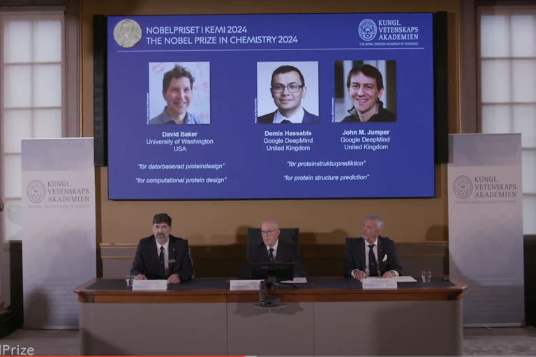 Screen with Novel Prize winners.