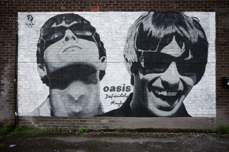 Photo of a black and white mural of Liam and Noel Gallagher of Oasis in Manchester