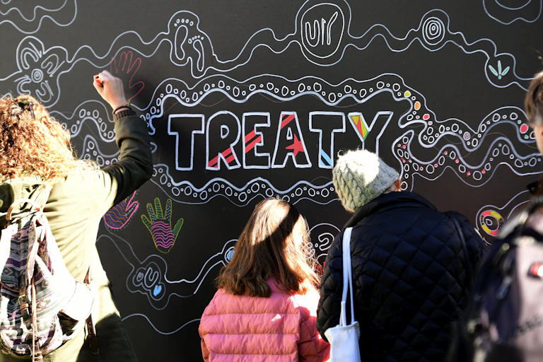 A mural featuring the word "Treaty"