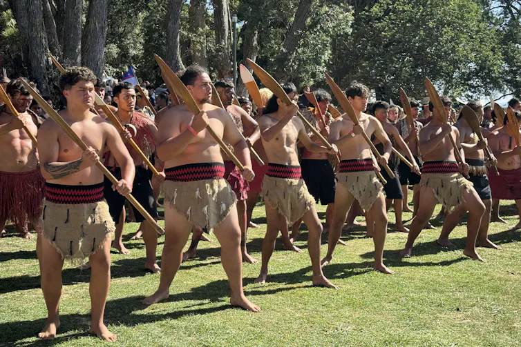 A Maori tribe in traditional dress line up
