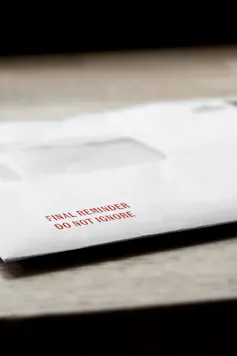 Final reminder do not ignore letter stamped in red on an envelope.