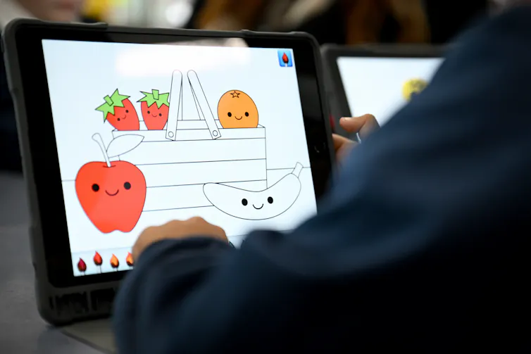A school student completes an activity on a tablet.