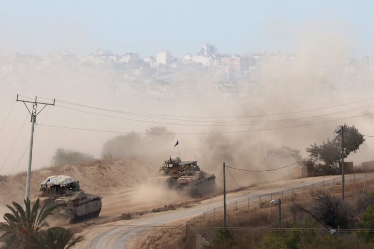 A convoy of Israeli armoured vehicles making its way to the northern Gaza Strip on October 6 2024.