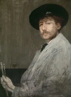 Self portrait of Whistler in artist's clothing and beret holding paint brushes