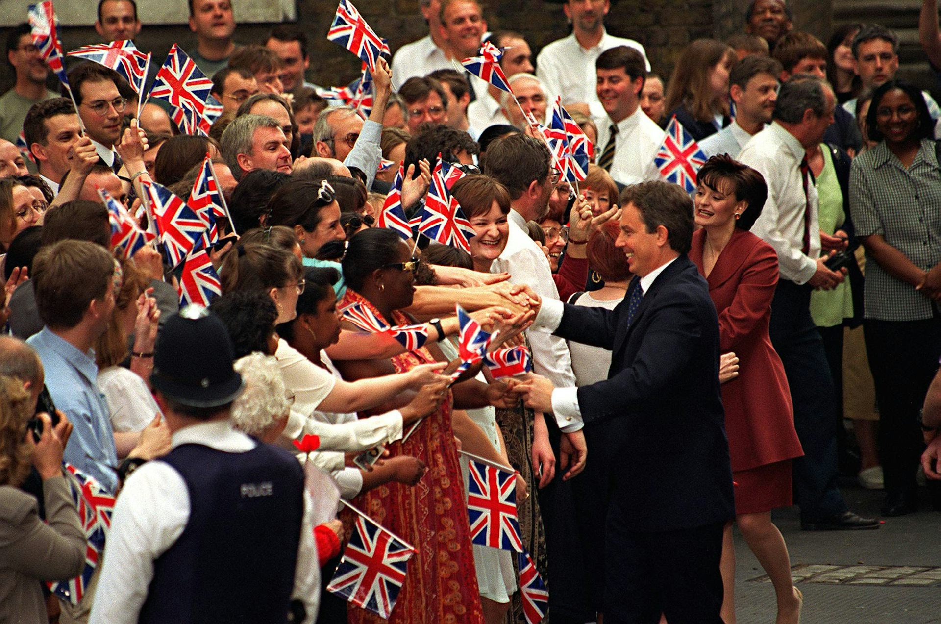 Tony and Cherie Blair shake hands of supportes outside Downing Street. 