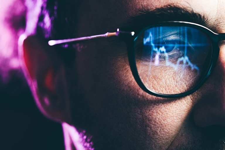 Close-up portrait of man working on computer.