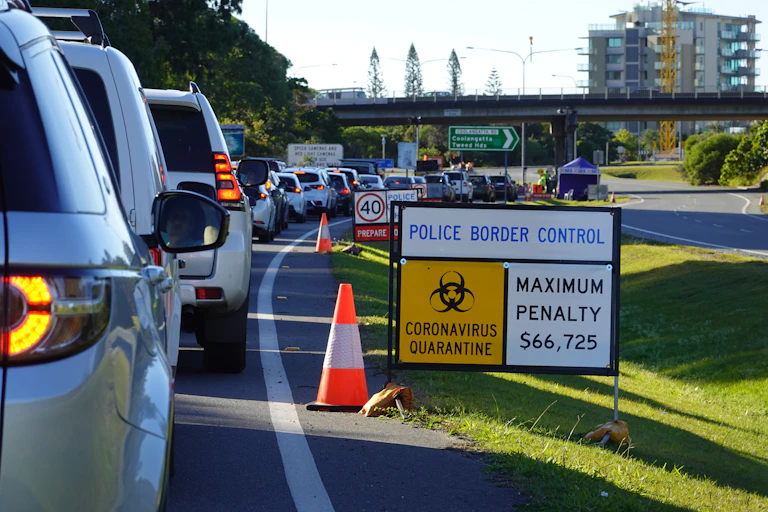 Cars waiting at a COVID checkpoint.