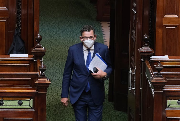 Daniel Andrews wearing a mask entering Victorian parliament.