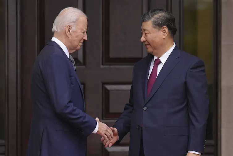 President Joe Biden greets China's President President Xi Jinping on the sidelines of the Asia-Pacific Economic Cooperative conference