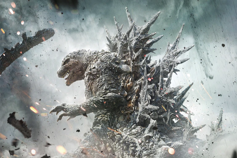 A monster bristling with spikes stalks through flying debris