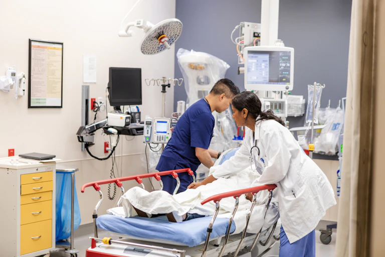 Doctor and nurse attend to patient in emergency room